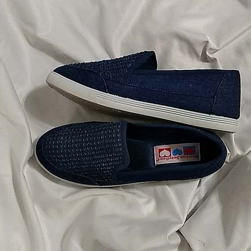 Dark blue casual slip-ons.